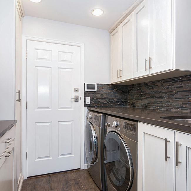 washer-and-dryer-in-laundry-room-with-white-cabinets-newport-news-va